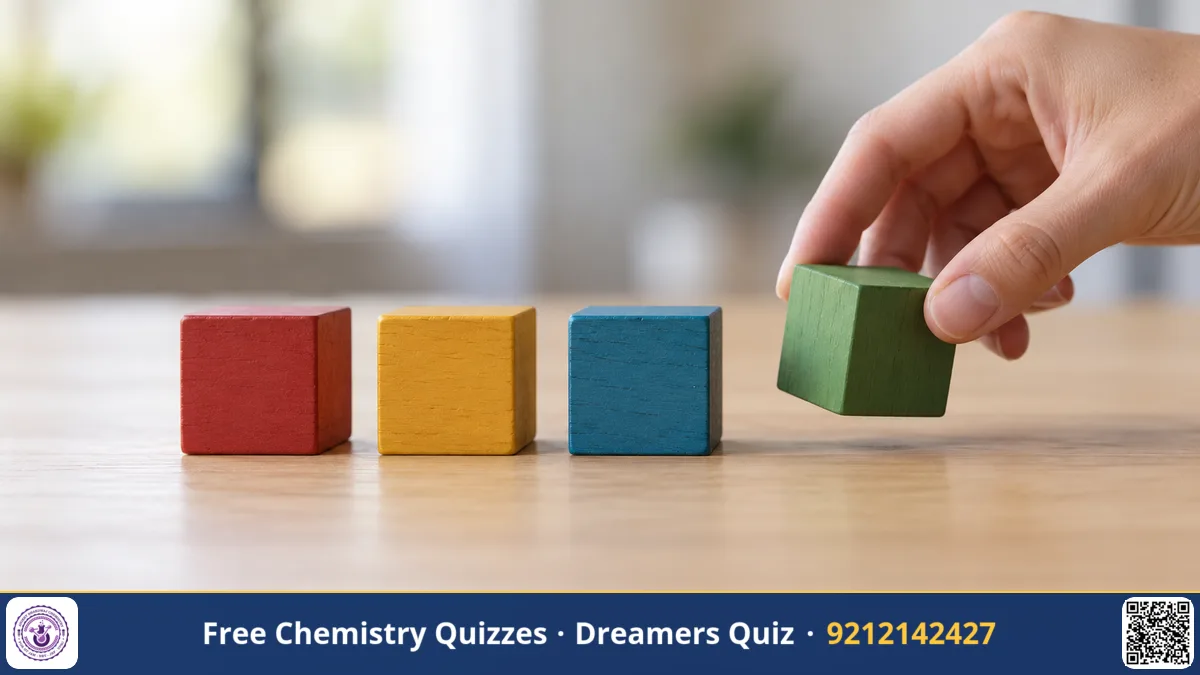 Four coloured wooden blocks in a row on a desk with a hand picking one up, shallow depth of field, clean background.